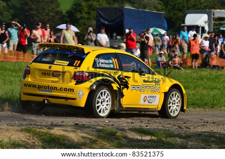 ZLIN,CZECH REP.-AUGUST 27. Driver Andersson P.G. and co-driver Axelsson E. with car Proton Satrig Neo S2000 at Barum Rally event,speed check Nr 6,August 27.2011 in Zlin,Czech republic