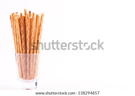 salty cracker pretzel sticks with white text space