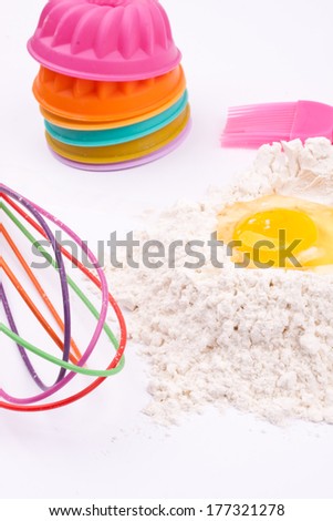flour,egg,whisk and with cake holders