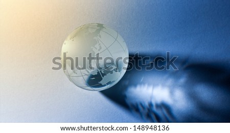 Glass globe in effect light.