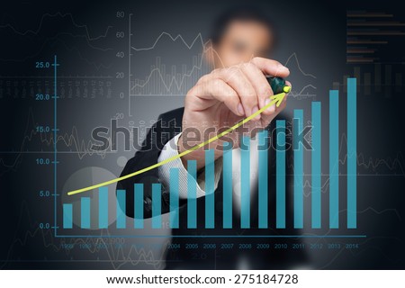 Investor with growth chart of profits.