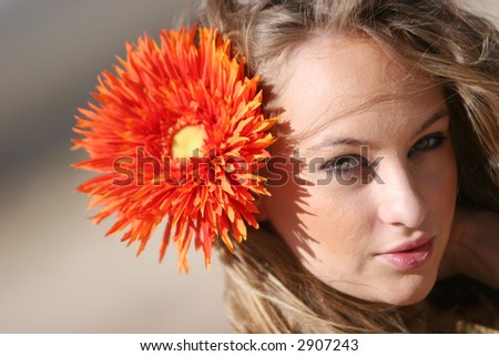 Pretty sexy woman with daisy on her hair