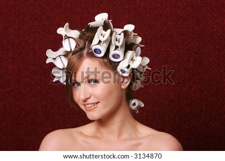 Girl with hair rollers on her hair