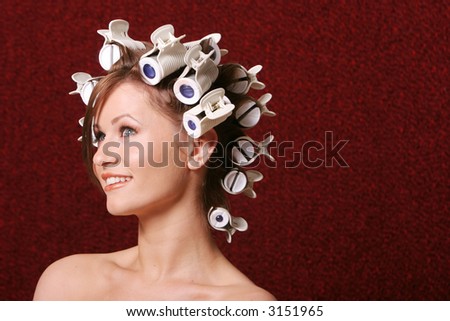 Woman with hair rollers on her hair