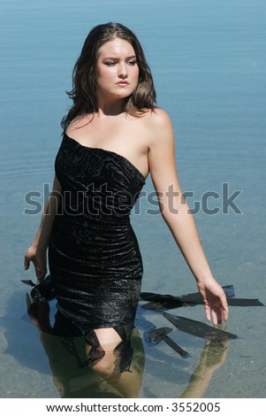 Beautiful sexy young woman in lake