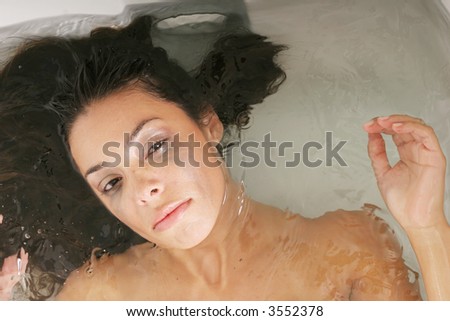 Depressed woman crying in the bathtub