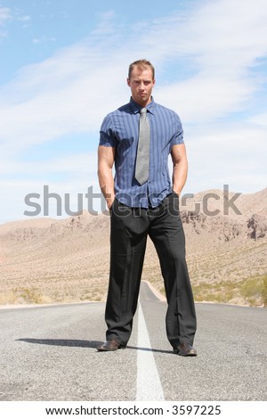 Confident businessman in the middle of the road