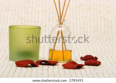 Fragrance sticks, candle and rose petals