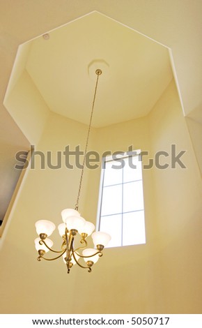 Entrance chandelier on high ceiling