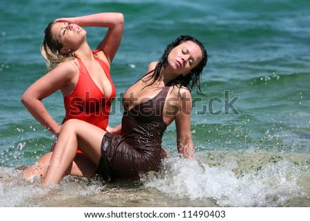 Couple sexy girls in wet dresses