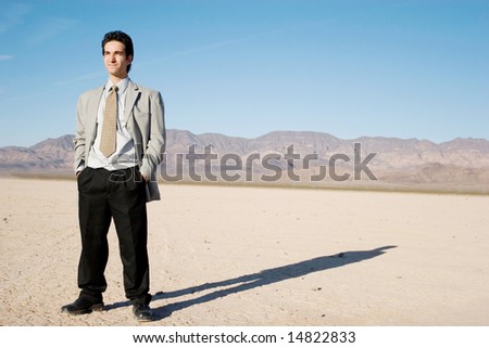 Young businessman in the desert