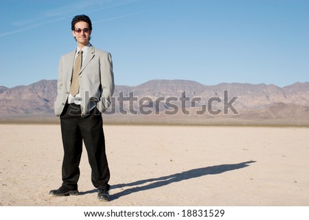 Young businessman in the desert