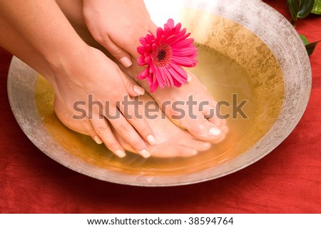 Hand and feet in bowl of water
