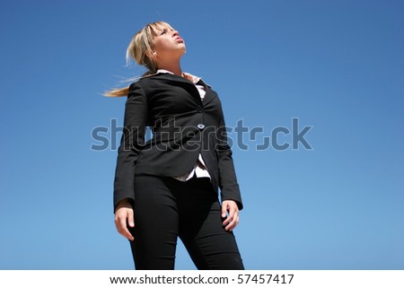 Young businesswoman in dark suit