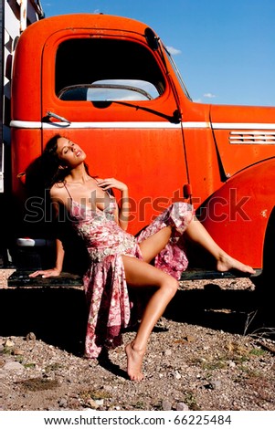 Sexy woman posing on a truck