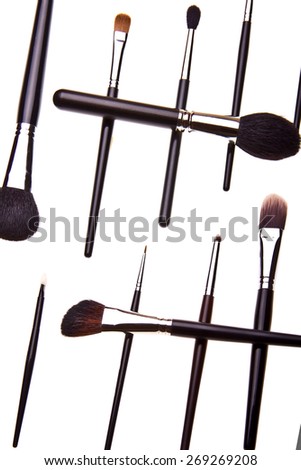 Pattern made of essential professional make-up brushes on white background. Overhead view. Black and white kit.