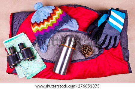 Travel set. Tourist outfit for camping on a sleeping bag.