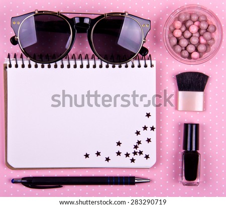 beautiful women\'s minimal set of fashion accessories on a pink background. Place for text. Ideal for blogs or magazines. Mock up. Decorated with stars. Polka dots.