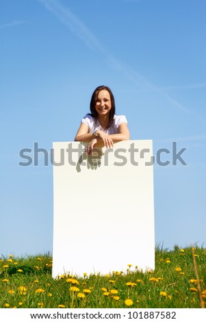 happy smiling woman against blue sky - space for text