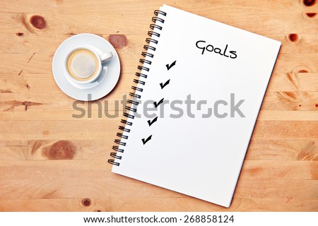 office - coffee - writing pad - goal checklist