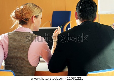 a successful business team is working on a table with a laptop