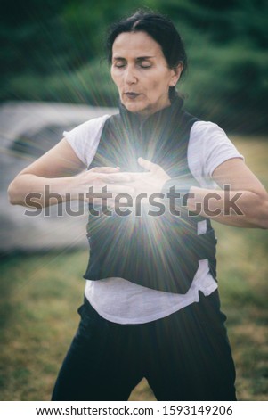 Chi Gong energy practice. Mature woman exercising in a park. ストックフォト © 
