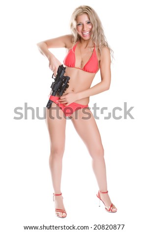 Beautiful girl in red bikini with the big black gun isolated on white