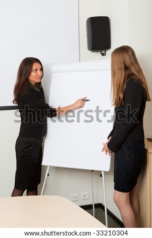 Business woman draws on a clean sheet