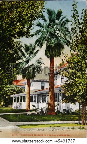 USA-CIRCA 1910: Vintage postcard of Fresno in the USA with hand painted image of the beautiful residence section in sunshine and palm trees, circa 1910