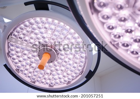 Two surgical lamps in operation room.
