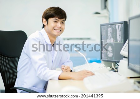 veterinarian doctor with MRI computer control