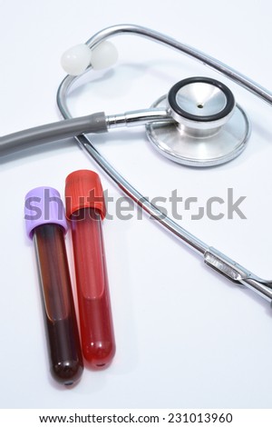 Blood test tube and stethoscope isolated white background.