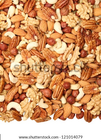 background of mixed nuts - pecans, hazelnuts, walnuts, cashews, almonds, pine nuts, pistachios, isolated from the bottom, the size of 4 to 3