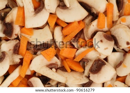 Background of sliced ??mushrooms and carrot cake mix ready for frying