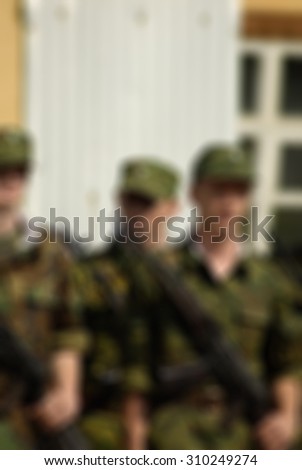 Russian army theme with armed soldiers blur background with bokeh