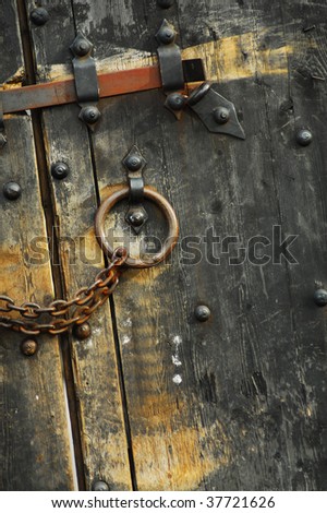 Heavy wooden doors with chains and padlocks are all about security