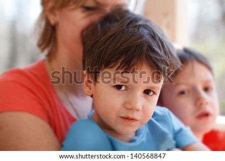 Little preschooler boy with mother and brother on train, travel