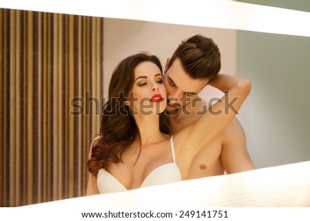 Passionate sensual couple in mirror, foreplay and desire