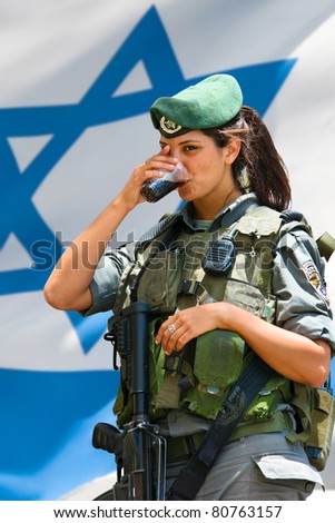 JERUSALEM, ISRAEL - MAY 30: Unidentified Israeli army girl at the Israel Expo, one of the largest celebration of Israeli culture on May 30, 2011 in Jerusalem, Israel.