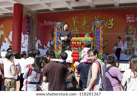 NEW TAIPEI CITY,TAIWAN -November 3,2012:chinese hand puppeteer in LuZhou elementary School for celebrating the Taiwanese Traditional Art Festival  on November 3,2012 in New Taipei City,Taiwan .