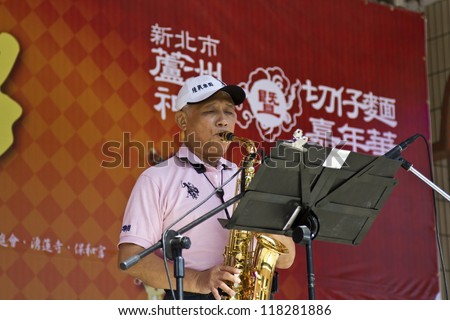 NEW TAIPEI CITY,TAIWAN -November 3,2012:saxophone performance in LuZhou elementary School for celebrating the Taiwanese Traditional Art Festival on November 3,2012 in New Taipei City,Taiwan .