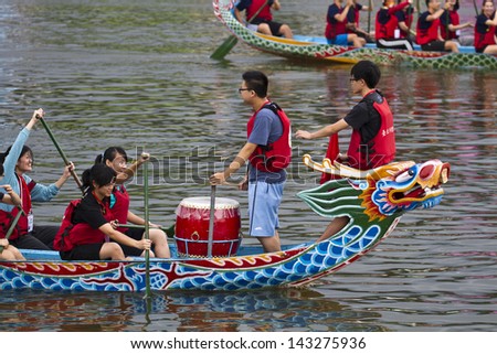 TAIPEI, TAIWAN-JUNE 9,2013:dragonboat teams racing during the 2013 Taipei Dragon Boat festival on JUNE 9,2013 in Taipei,Taiwan