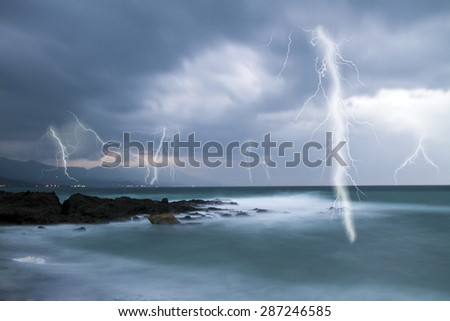Lightning flashes across the beach from a powerful storm