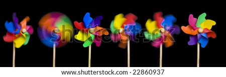 Blowing in the Wind: toy windmills; isolated on easily-extendable black ground to give good copy-space; high resolution so each image can be used on its own