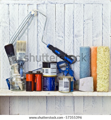 Do it Yourself (DIY) and decorating tools on workshop shelf --  good copy space on white-painted wall