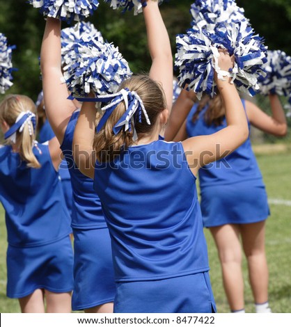 Cheerleaders Cheering at Football Game