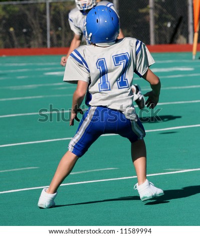 Youth Teen Football Player Ready to Catch ball during game 2