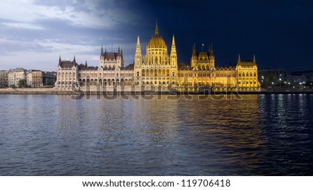 day and night shot of parliament building in the budapest, hungary