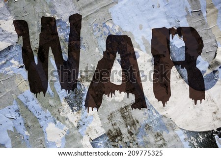 old grungy blue and grey  billboard with the word war in dark red color