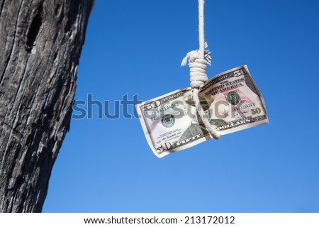 one fifty Dollar banknote hanging in the air at a  gibbet cord: Concept for Dollar crisis, financial benefit or trap